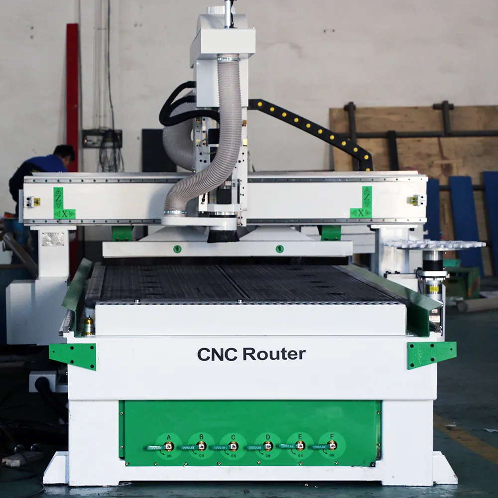 4x8 Rotary ATC CNC Machining Center for Woodworking (12-Tool Magazine) 3 Front view of YIHAICNC 1325 carousel ATC CNC router featuring gantry-mounted 16-tool rotary magazine and 6-zone vacuum bed