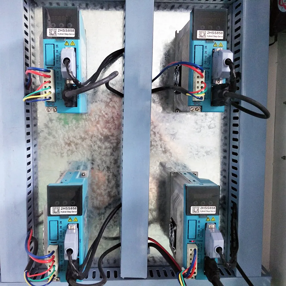 Industrial 4x8 CNC Router With Side Drilling Spindle For Cabinet Making 9 Four 2HSS858 digital hybrid step-servo drivers with dual Y-axis drive configuration in CNC cabinet