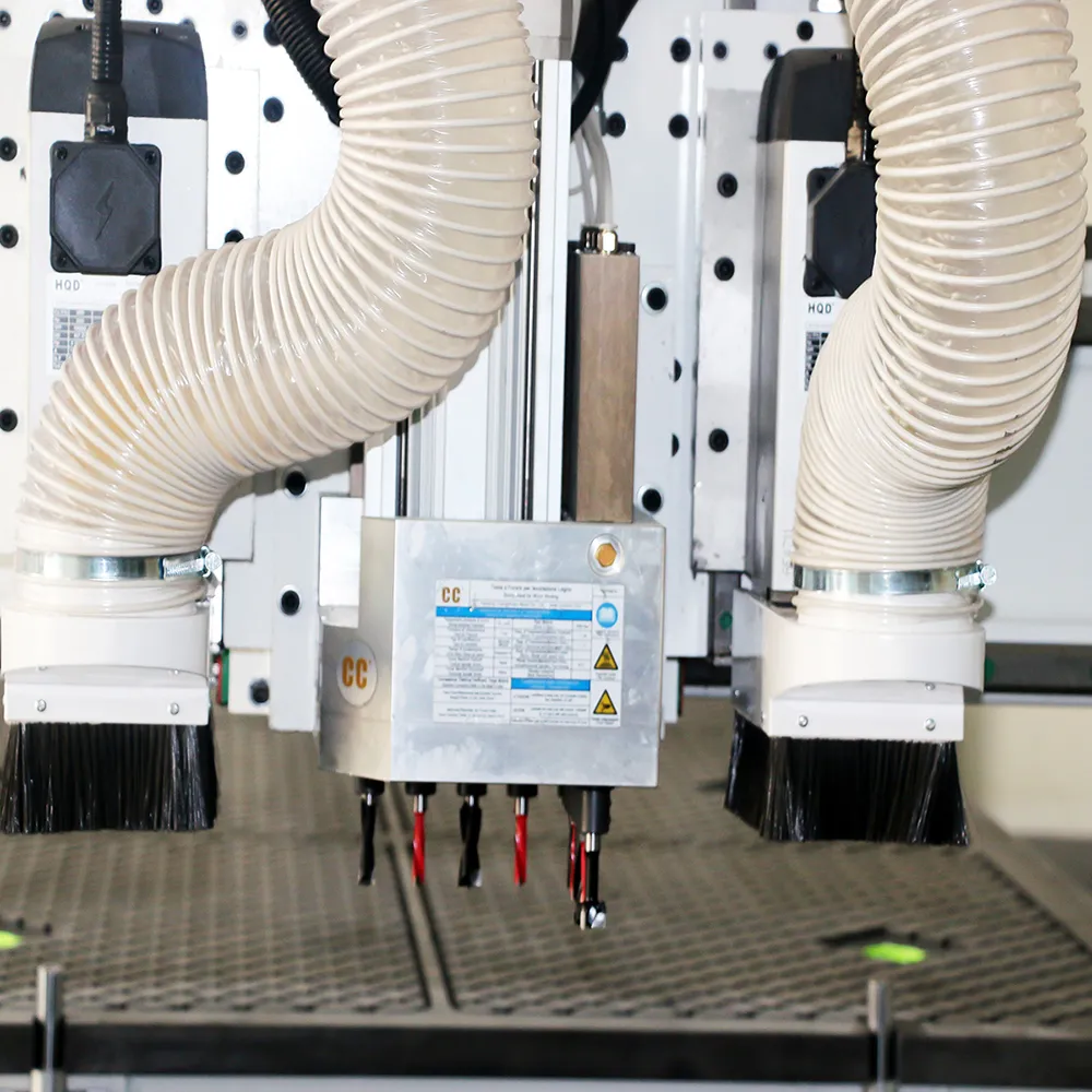 4x 16 Three Process CNC Nesting Machine With Drill Bank For Cabinet Production 7 Close-up of twin HQD air-cooled routing spindles and integrated vertical boring drill bank with dust collection hoods