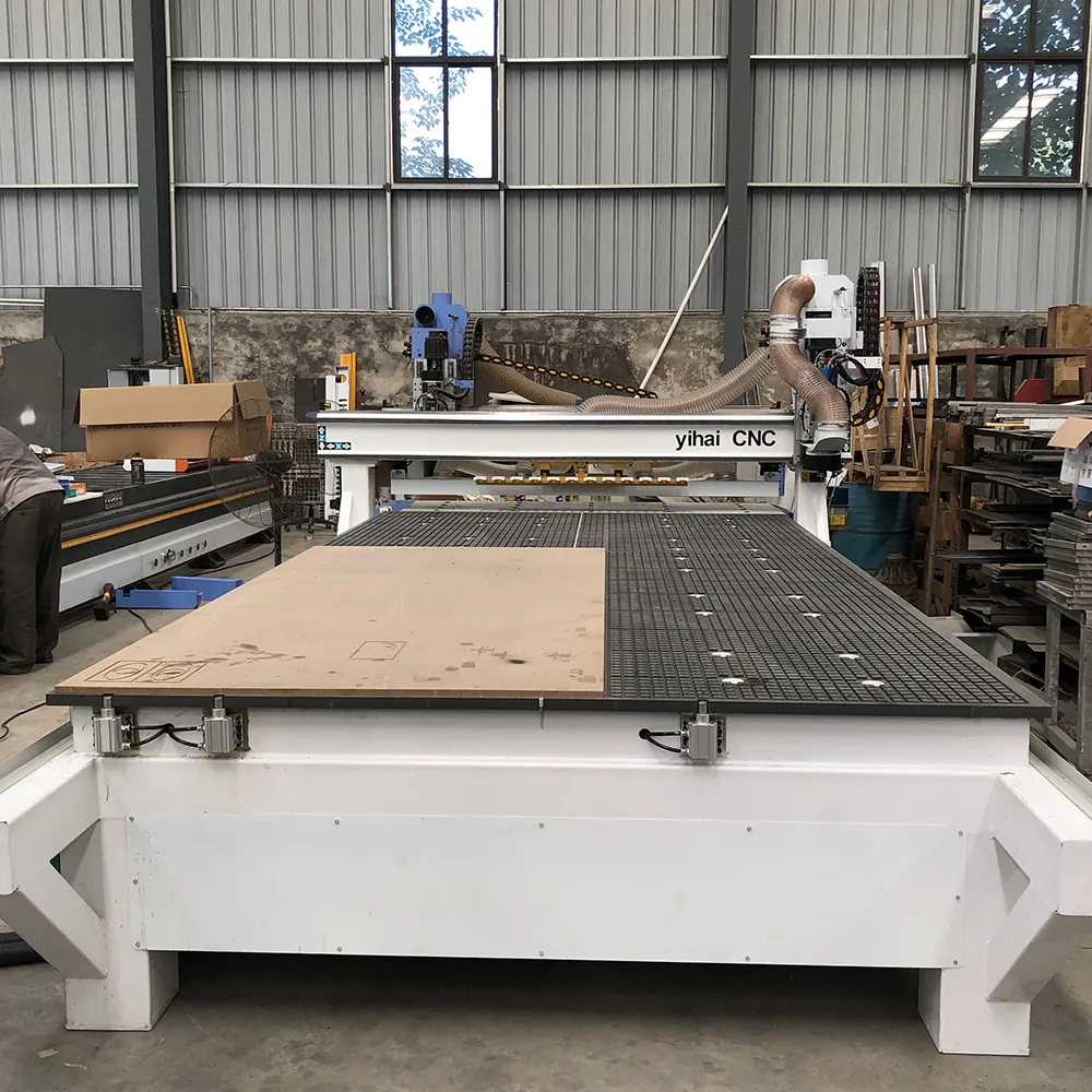 5x10 Linear ATC CNC Router With 12 Tools For Large Panel Processing 3 Front view of YIHAICNC 5x10 linear ATC CNC router showing 1500x3000mm vacuum bed and pneumatic pop-up pins