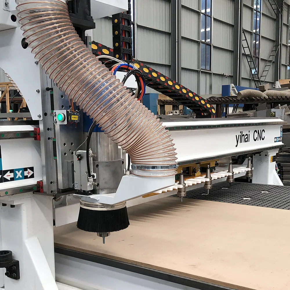 5x10 Linear ATC CNC Router With 12 Tools For Large Panel Processing 5 Close-up of 9KW air-cooled ATC spindle with dust extraction shoe and gantry-mounted 12-tool linear rack