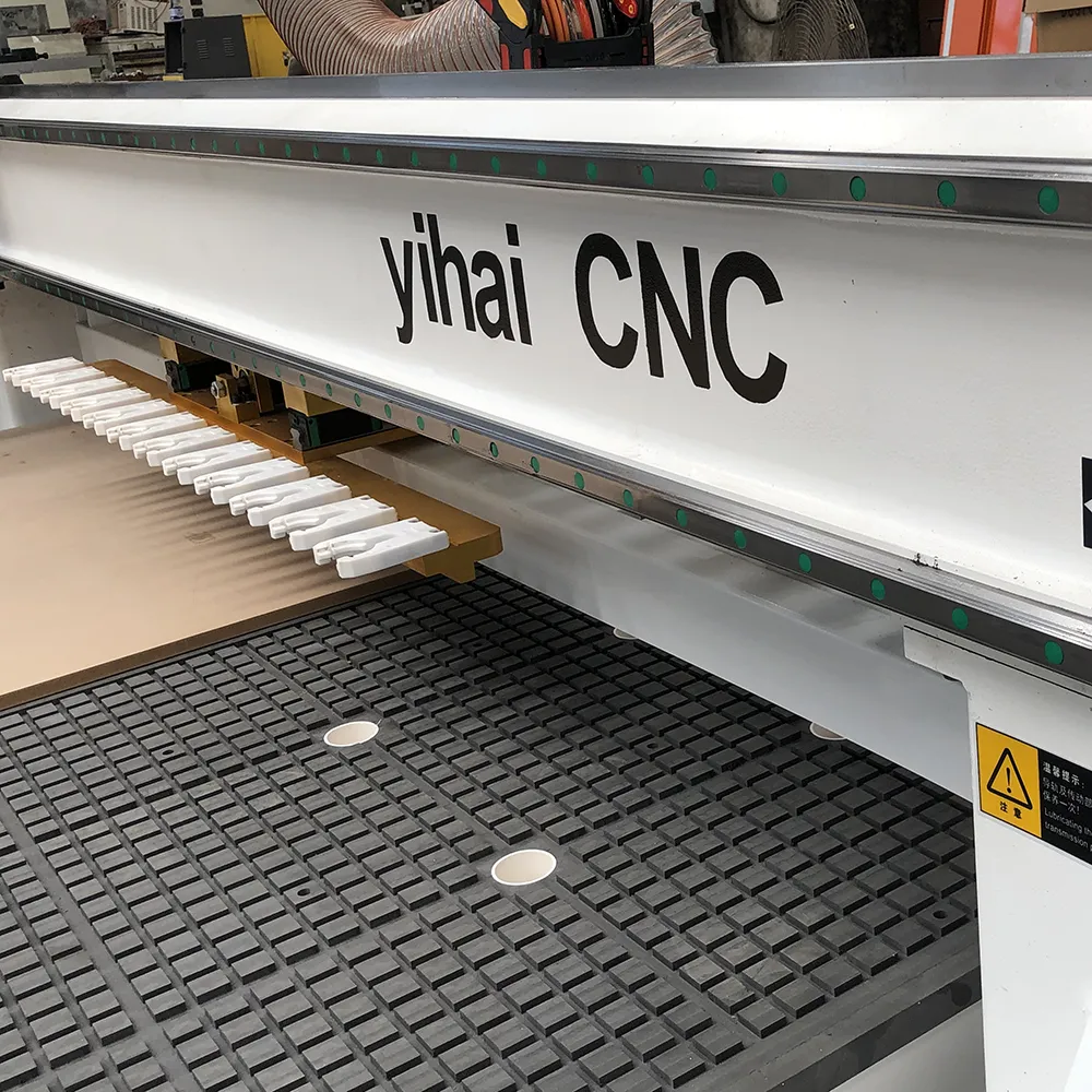 5x10 Linear ATC CNC Router With 12 Tools For Large Panel Processing 9 High-density phenolic vacuum grid table with large suction ports and linear square guide rail on 1530 CNC router